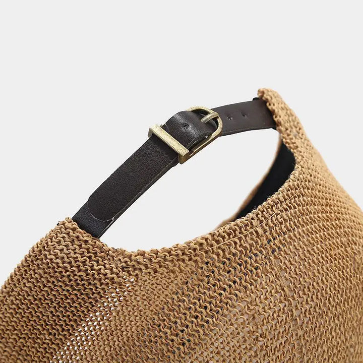 Close-up of the adjustable leather strap on a breathable woven Bayfield Sun Cap, showcasing its stylish design.