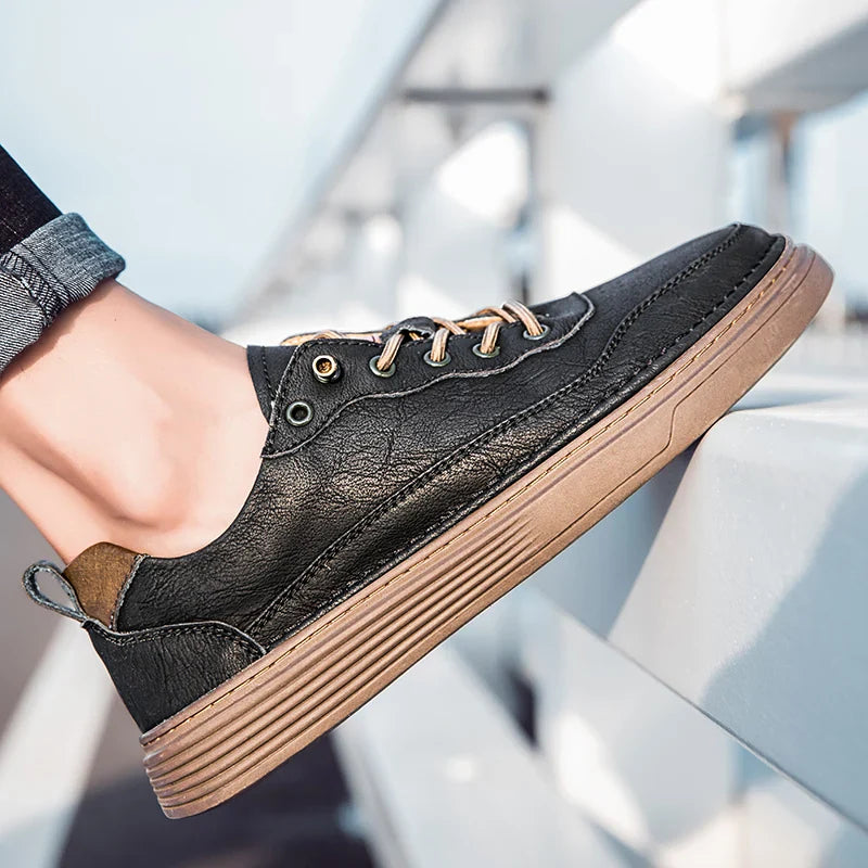 Alvo Genuine Leather Sneakers in black with hand-stitched detailing, showcasing a comfortable fit and stylish design.
