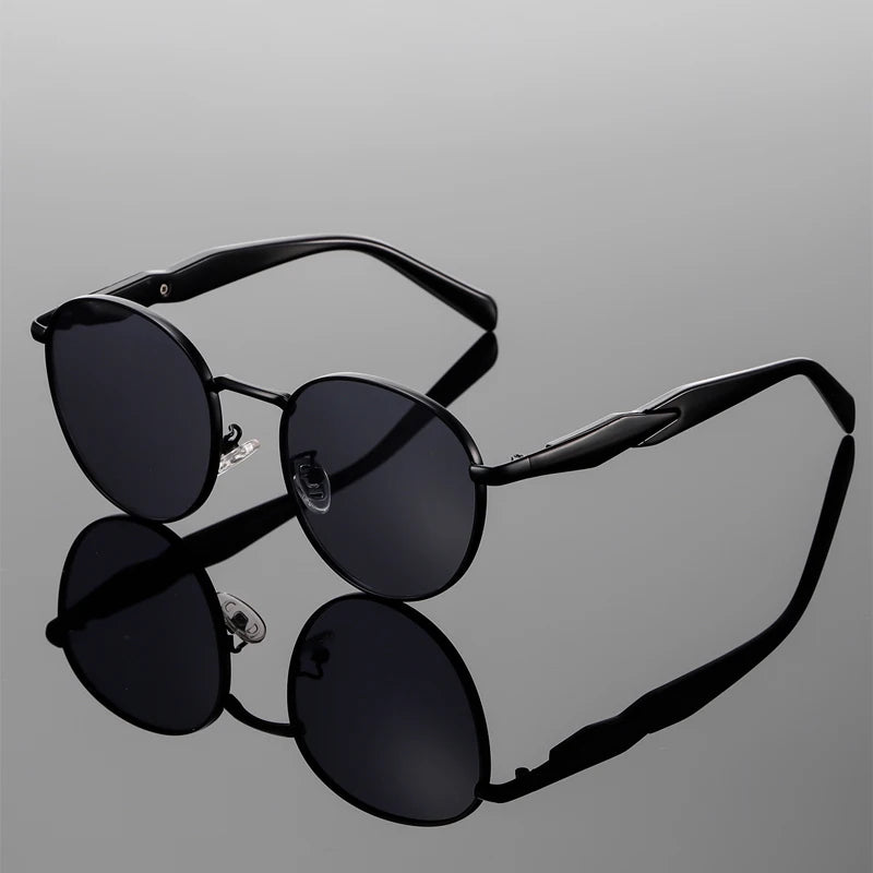 Bellano Sunglasses: bold round-frame, polished metal accents, UV400 protection, retro-inspired design.
