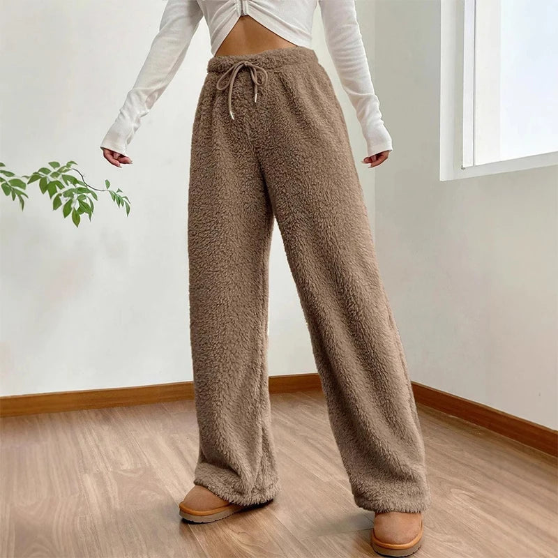 Soft brown Sherpa flow sweatpants with a relaxed wide-leg fit and adjustable drawstring waist, perfect for lounging.
