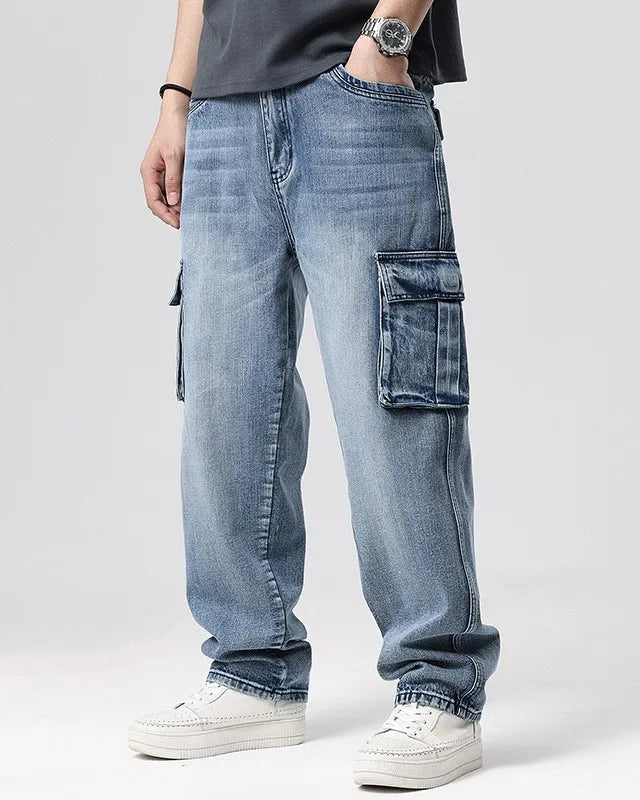 Ryder washed cargo jeans featuring oversized pockets and relaxed wide-leg fit in heavyweight denim.
