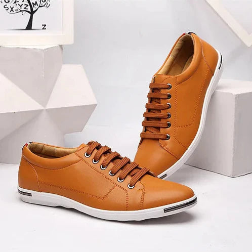 Paxton Low-Top Comfort Sneakers in tan leather with hidden lacing, designed for all-day comfort and versatility.