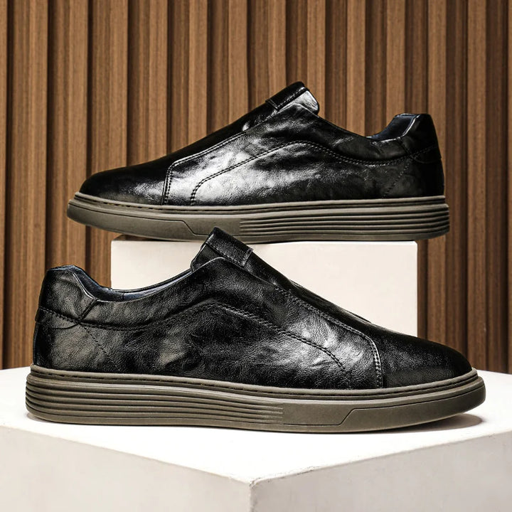 Alvio Genuine Leather Shoes in black, featuring a slip-on design, cushioned footbed, and smooth leather for daily comfort.
