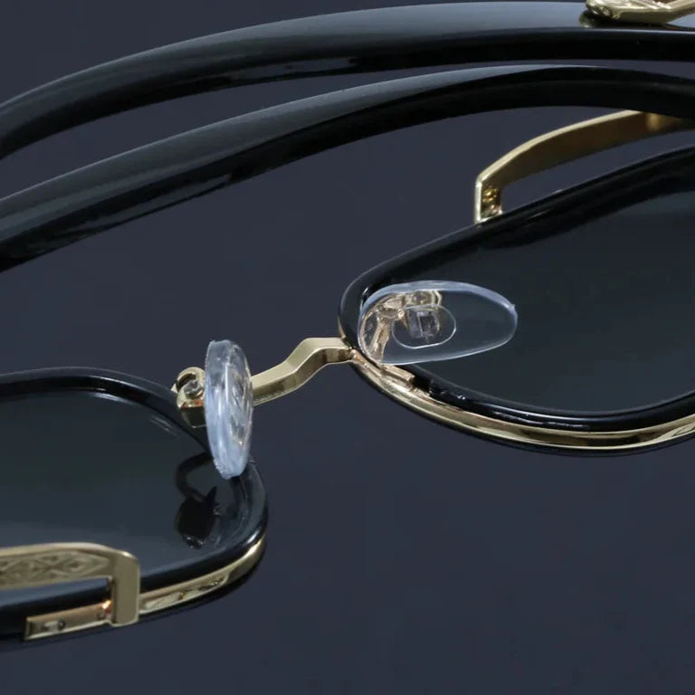 Close-up of Elias Rectangle Frame Sunglasses showcasing sleek black frame and adjustable nose cushions.