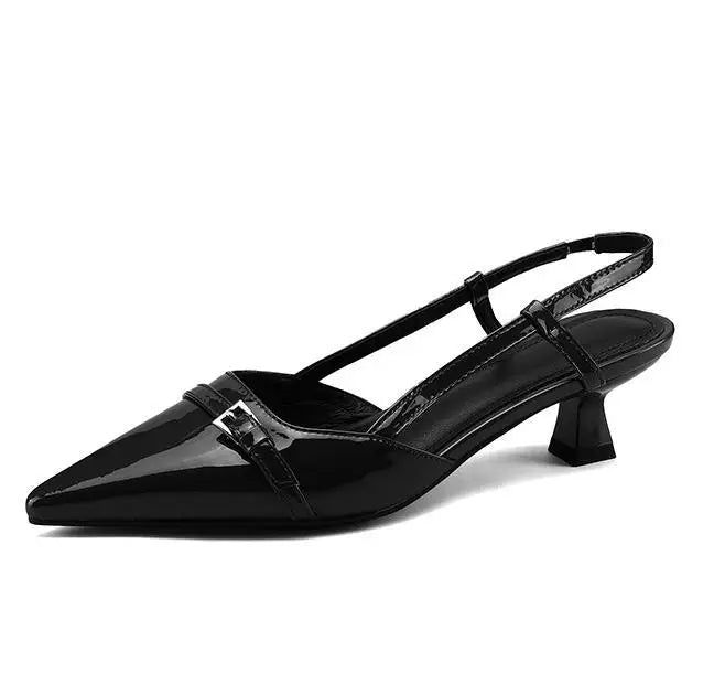 Shine Point Slingback Heels featuring glossy black finish, pointed toe, flared mid-heel, and adjustable strap for comfort.