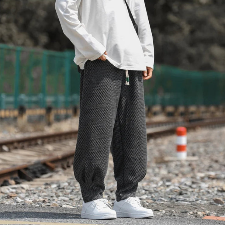 Oslo textured joggers featuring a relaxed fit, adjustable drawstring waist, and tapered cuffs, styled with a casual shirt.