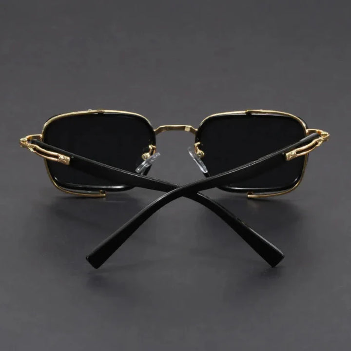 Elias rectangle frame sunglasses with sleek metal design and black lenses, offering UV protection and adjustable fit.