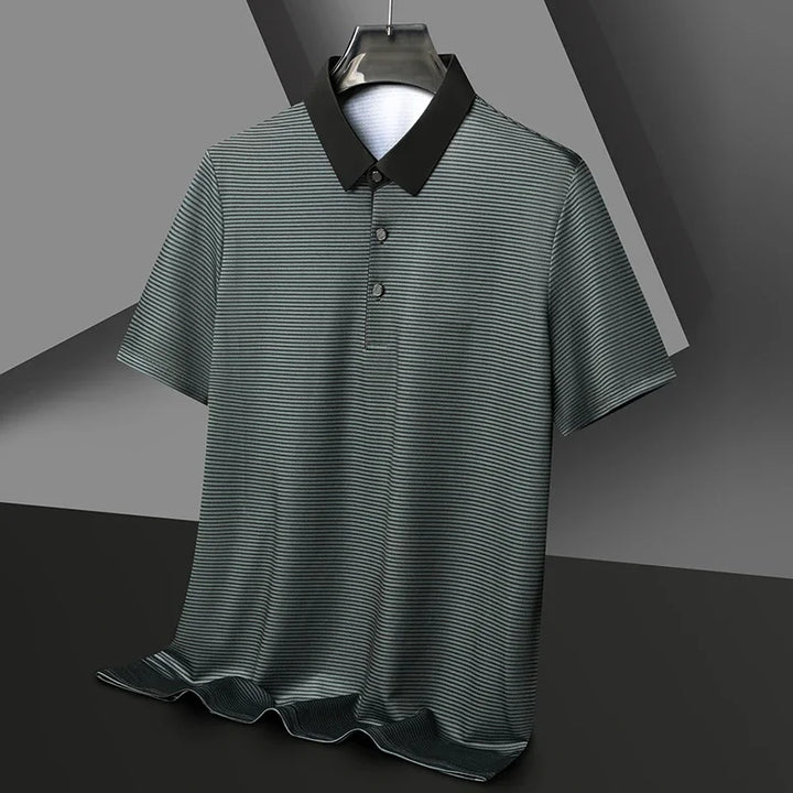 Eden Striped Polo featuring high-stretch fabric, bold contrast collar, and sharp micro-stripe texture for a modern look.