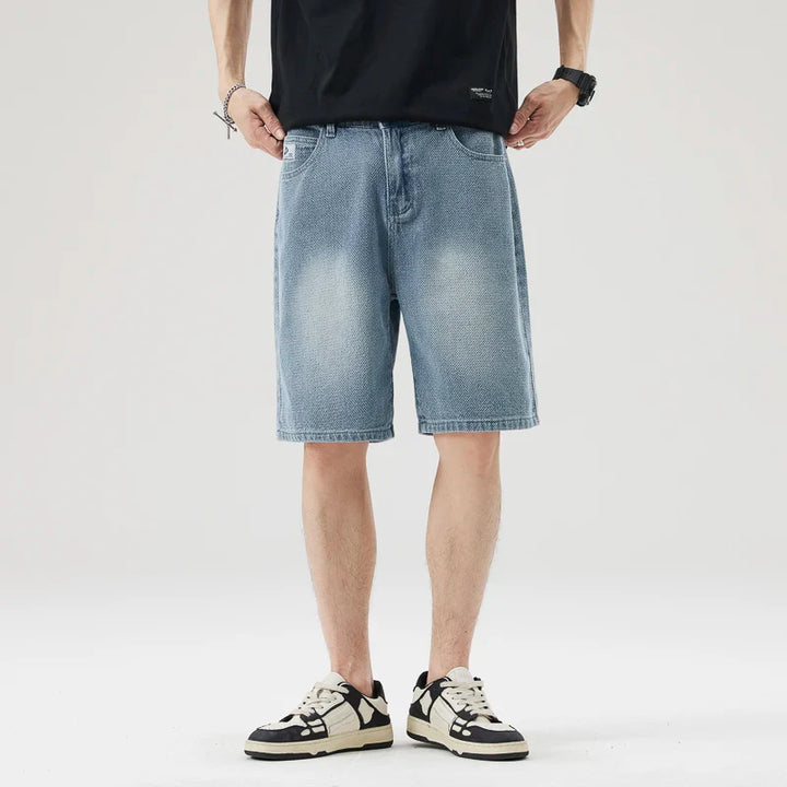 Men's Axel Faded Wash Denim Shorts with a relaxed straight-leg fit, showcasing unique crosshatch texture and tonal fade.