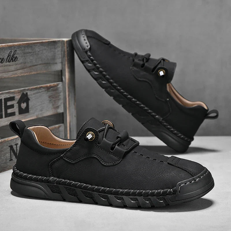 Vantage genuine leather shoes, black lace-up style with durable design and flexible rubber sole for comfort and grip.