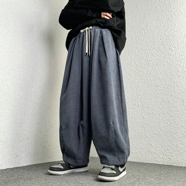 Arlo corduroy pants with wide-leg fit, adjustable drawstring, and deep pockets for a stylish, relaxed look.