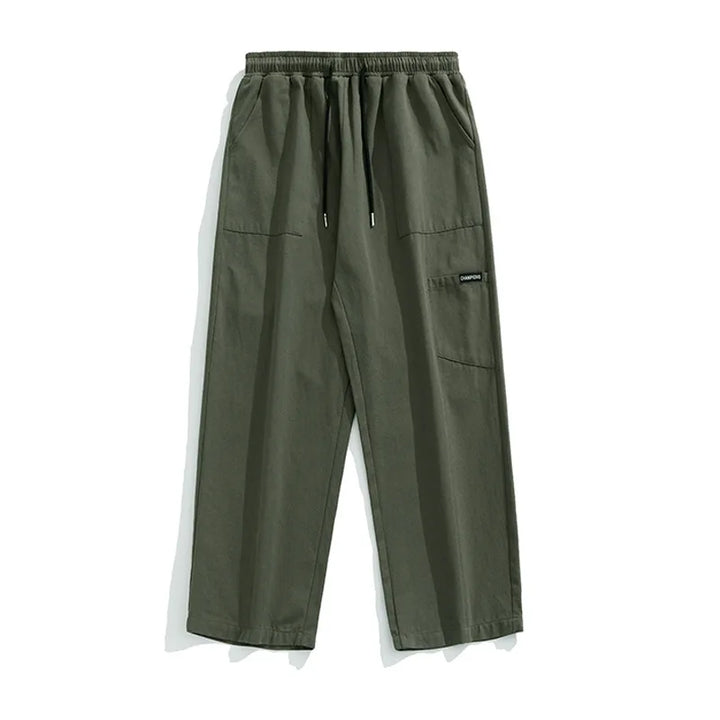 Huxley Men's 100% Cotton Cargo Pants in olive green with oversized pockets and adjustable drawstring waist.