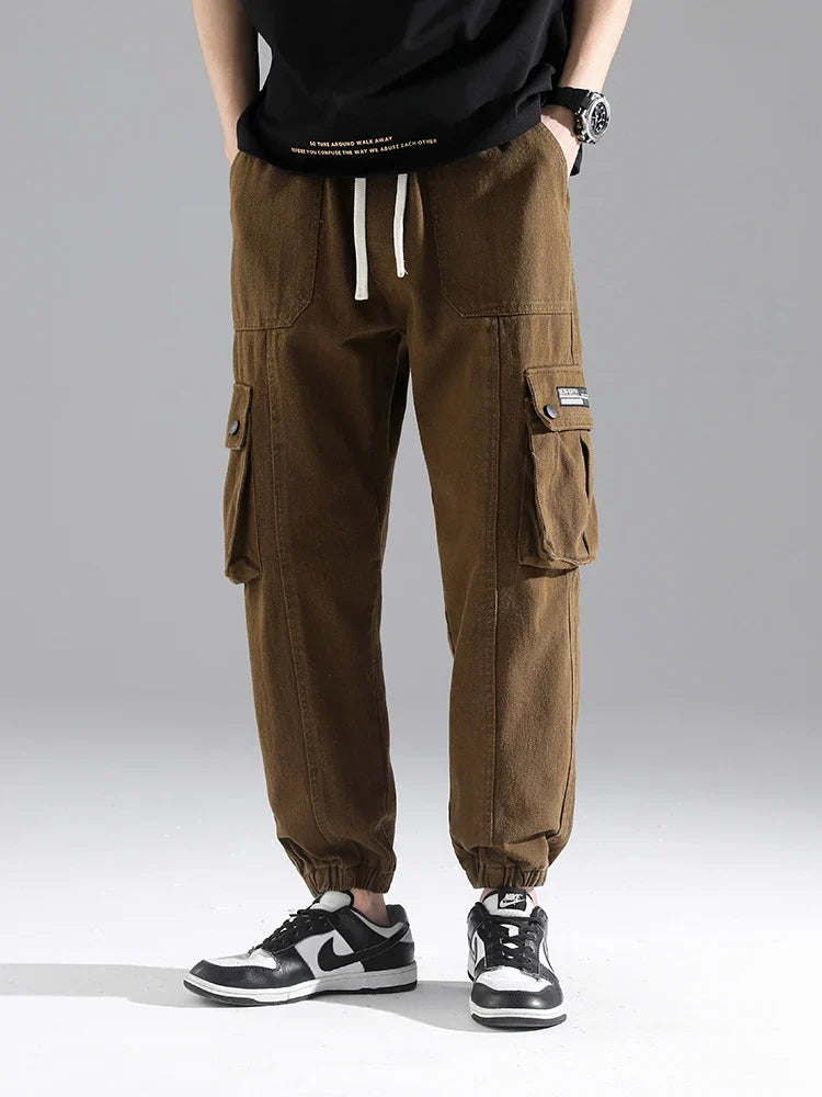 Lennox Cargo Joggers in brown with oversized snap pockets and gathered cuffs, perfect for casual wear and style.