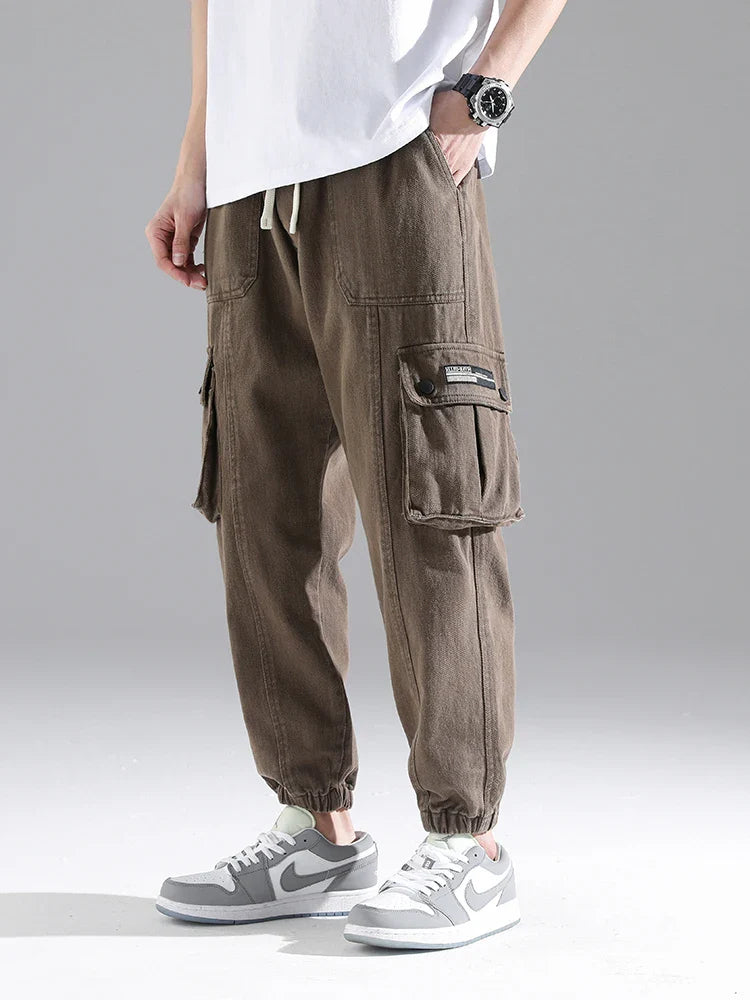 Lennox Cargo Joggers in heavyweight cotton blend, featuring oversized pockets and elastic cuffs for a relaxed fit.