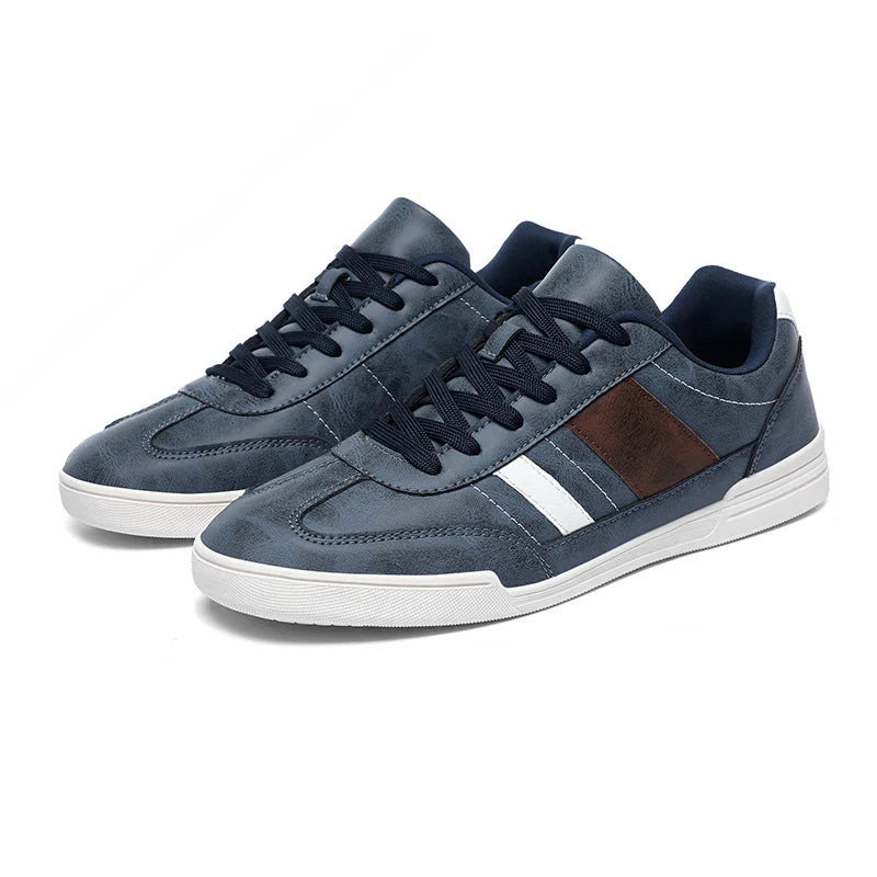 Rival™ Sport Sneakers in navy blue with brown contrast paneling and sleek low-profile design for all-day comfort.