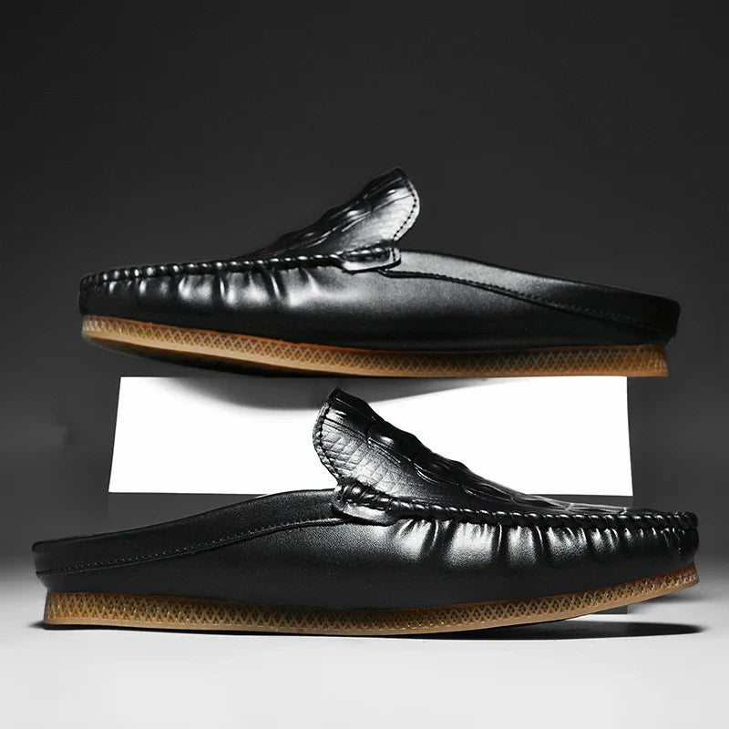 Gianni Backless Slide Loafers showcasing embossed upper and classic moc toe for stylish daily wear.