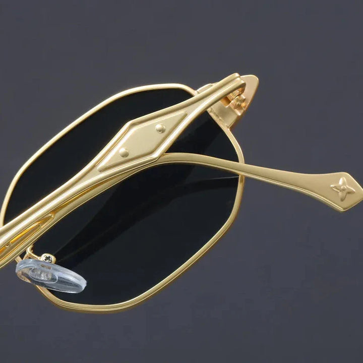 Stylish Atlas Alloy sunglasses featuring geometric frames and sculpted gold metal arms for a standout look.