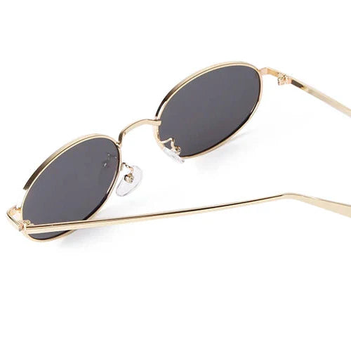 Orin Oval Frame Sunglasses with polished metallic finish and black lenses, featuring adjustable nose pads for comfort.