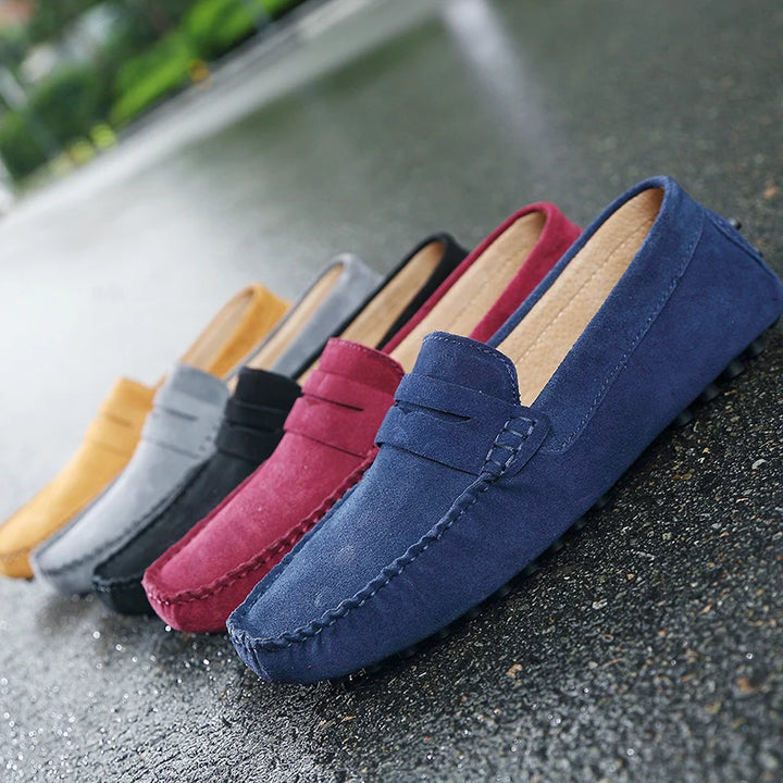 Grazia suede loafers in various colors displayed on a wet surface, showcasing their stylish, flexible design.