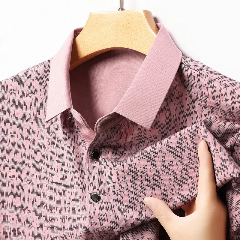 Close-up of Auren Men's Jacquard Polo Shirt showcasing its textured fabric and structured collar in pink.