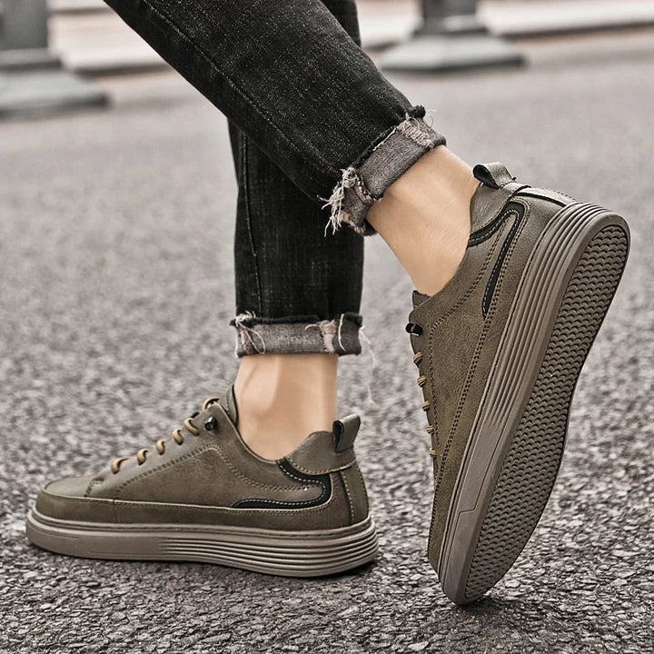 Genesis Leather Sneakers in olive green, featuring a cushioned interior and durable rubber sole, perfect for versatile styling.