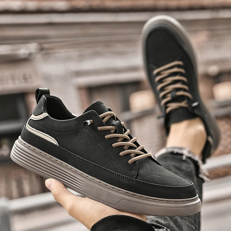 Genesis Leather Sneakers in black, featuring genuine leather, cushioned interior, lace-up design, and durable rubber sole.