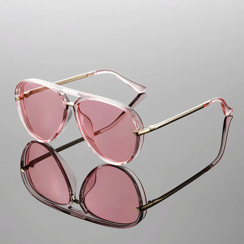 Stratos sunglasses featuring a classic aviator design with pink tinted lenses and a sleek double-bridge frame.