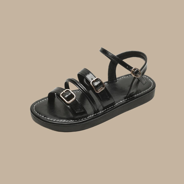 Luna Leather Flat Sandals featuring soft leather straps, cushioned footbed, and triple buckle closures for a secure fit.