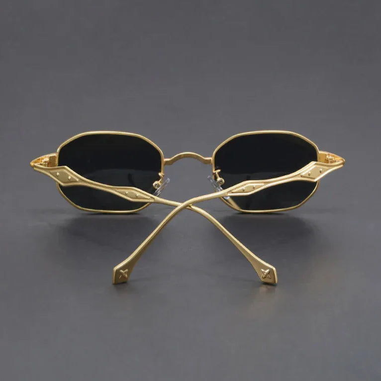 Atlas Alloy Sunglasses with a striking geometric design, featuring golden metal arms and black scratch-resistant lenses.