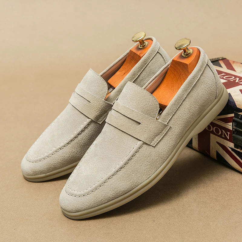Levor men's suede loafers in light gray with sculptural strap and cushioned footbed, designed for comfort and style.