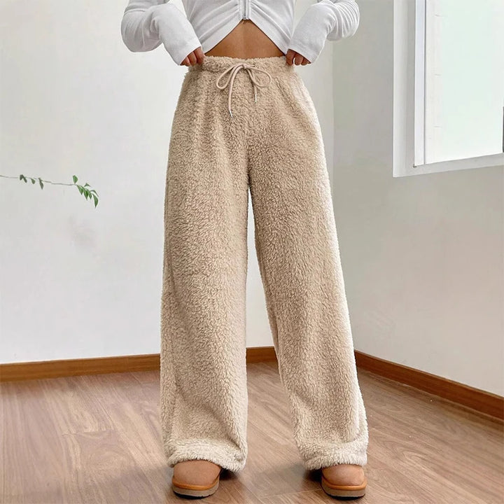 Comfy Sherpa flow sweatpants with wide-leg fit and adjustable drawstring waist, perfect for lounging or errands.