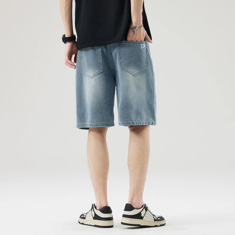 Men's Axel Faded Wash Denim Shorts with unique crosshatch texture and tonal fade, featuring a relaxed straight-leg fit.
