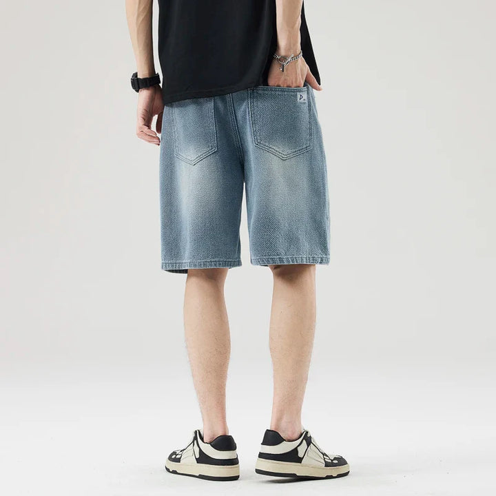 Men's Axel Faded Wash Denim Shorts with unique crosshatch texture and tonal fade, featuring a relaxed straight-leg fit.