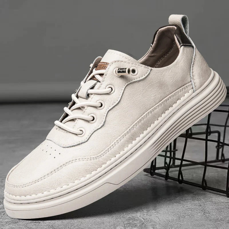 Alvo Genuine Leather Sneakers in white, featuring hand-stitched details and a comfortable, adaptive design for everyday wear.