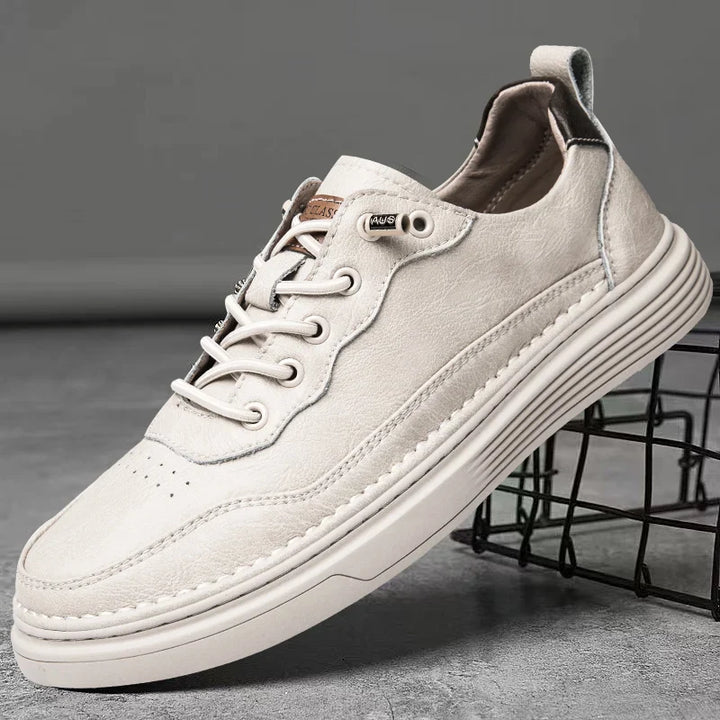 Alvo Genuine Leather Sneakers in white, featuring hand-stitched details and a comfortable, adaptive design for everyday wear.