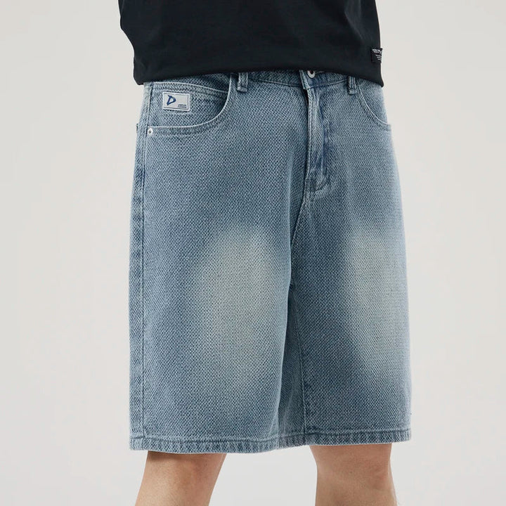 Men's Axel Faded Wash Denim Shorts showcasing unique crosshatch weave and relaxed straight-leg cut.