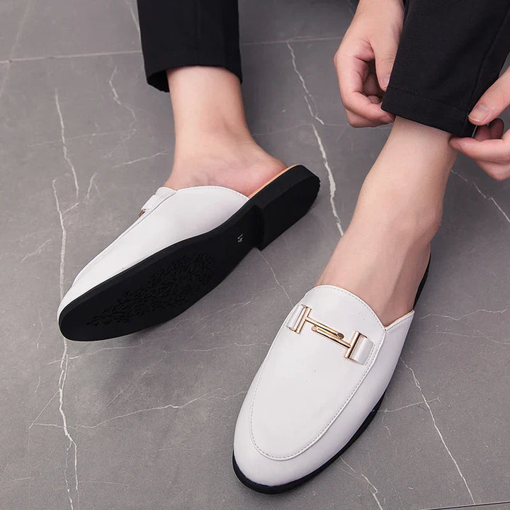 Santino Backless Slide Loafers in white with gold hardware, showcasing polished finish and sleek slip-on design.