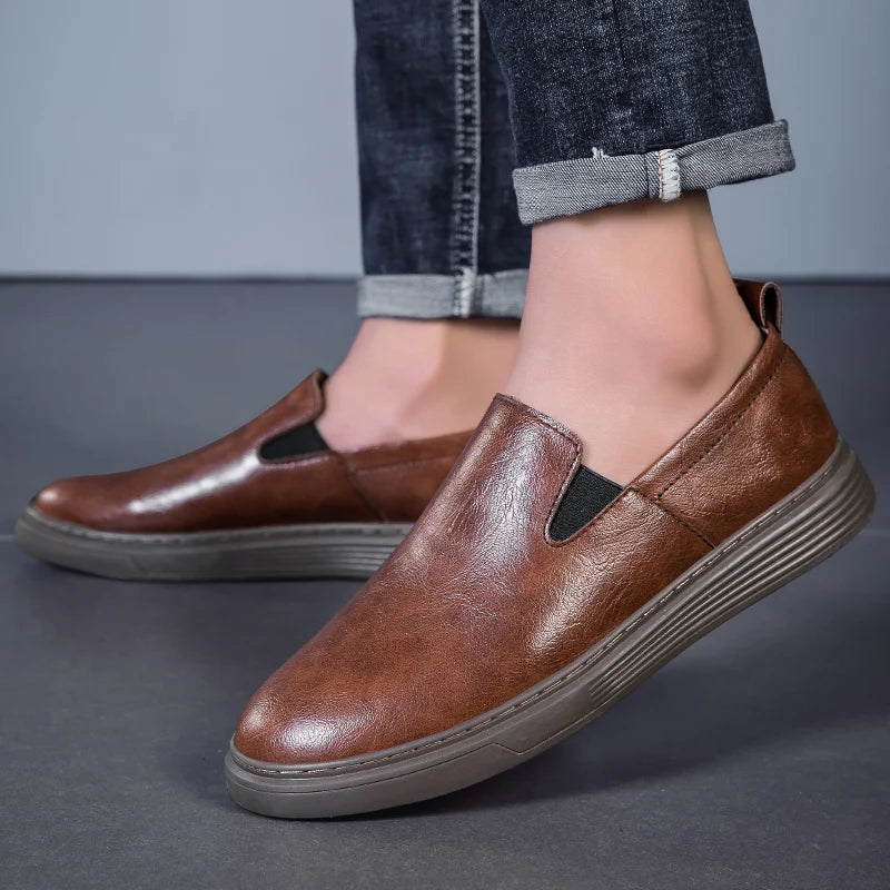 Duke Leather Slip-On Shoes in brown, featuring a cushioned sole and elastic side panels for comfortable wear.