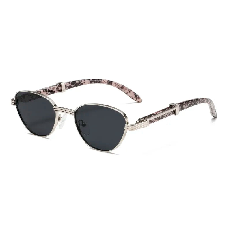 Orion Veil Sunglasses featuring sleek silver frames and unique pink snake-print arms with dark lenses.