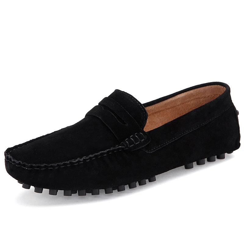 Grazia suede loafers in black featuring a soft suede upper and textured rubber sole for a stylish, flexible fit.