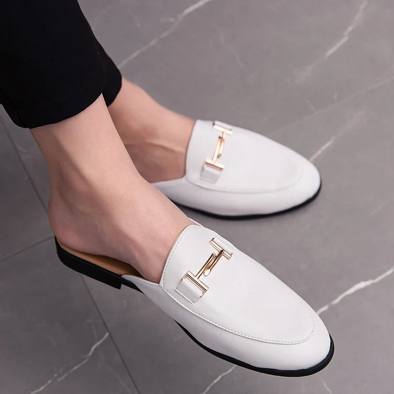 Santino Backless Slide Loafers in polished white leather with gold bit detail, stylish slip-on design for effortless wear.