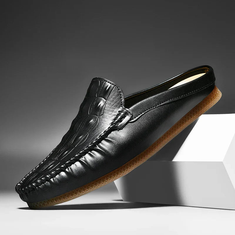 Gianni backless slide loafers with embossed upper and moc toe, perfect for stylish, comfortable daily wear.