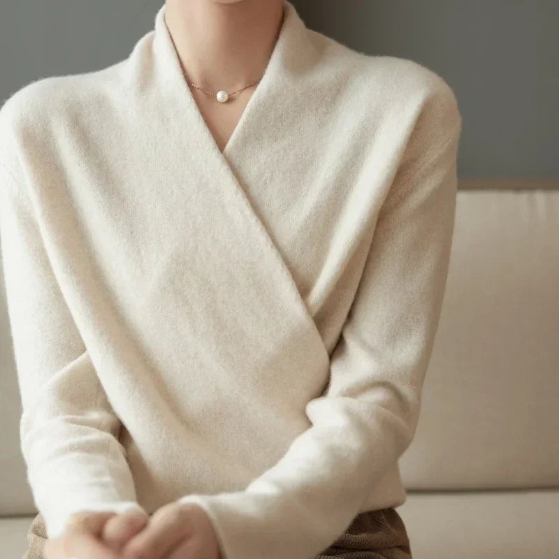 Elegant wrap-front wool sweater, offering luxurious comfort and a flattering relaxed fit for any occasion.