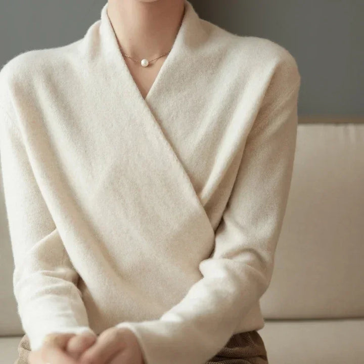 Elegant wrap-front wool sweater, offering luxurious comfort and a flattering relaxed fit for any occasion.