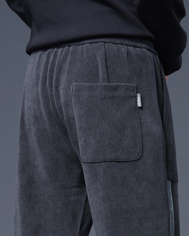 Close-up of Amos Corduroy Joggers showcasing large pocket and relaxed fit for casual style and comfort.
