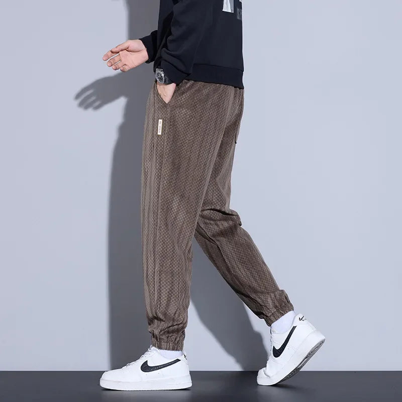 Men's Riden Checkered Corduroy Pants in tapered fit, showcasing rich texture and soft brushed interior for warmth.
