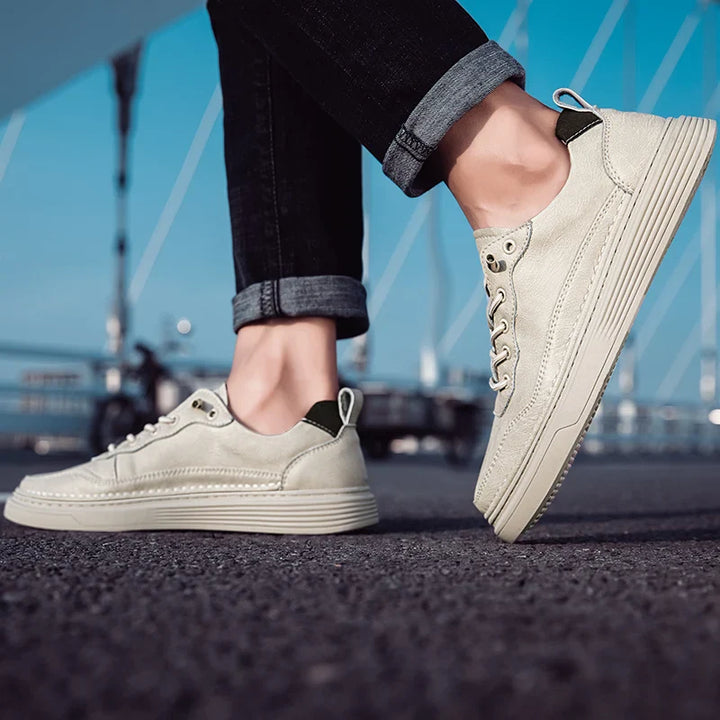 Alvo Genuine Leather Sneakers in beige, showcasing artisanal hand-stitched detailing and sleek design for everyday comfort.