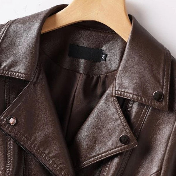 Brown leather jacket on a mannequin with a visible brand tag.