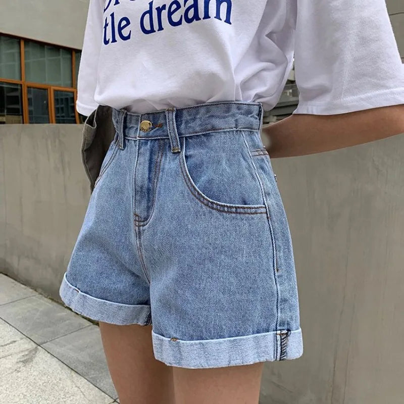 Sienna Retro Denim Shorts: High-waisted cuffed denim shorts in light blue, perfect for a vintage Y2K style.