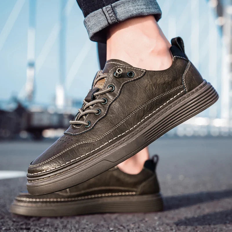 Alvo Genuine Leather Sneakers in dark brown, showcasing artisanal hand-stitched details and a supportive sole.